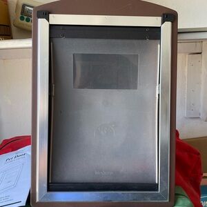 Brown and Silver Pet Door